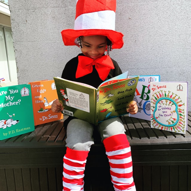 Girl reading with books.