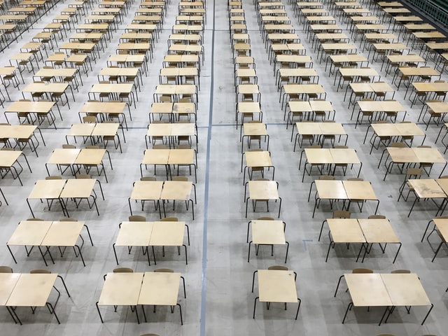 Exam hall desks empty.