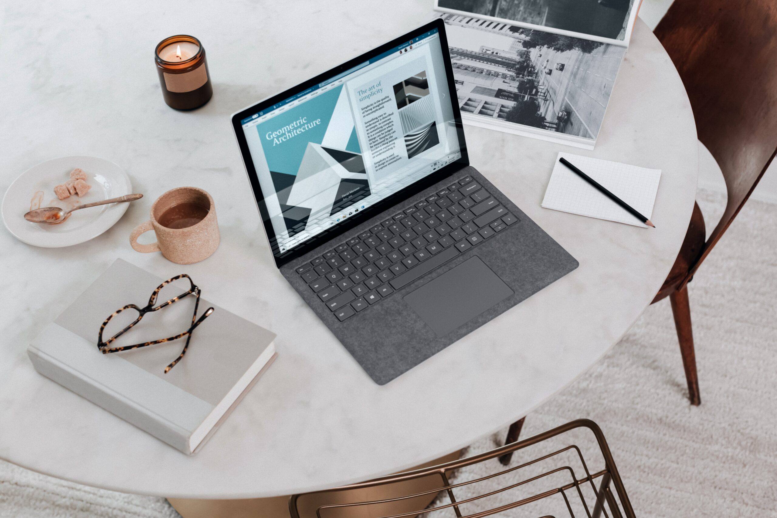 Laptop and diary on a table