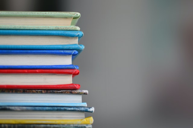 colourful books piled up