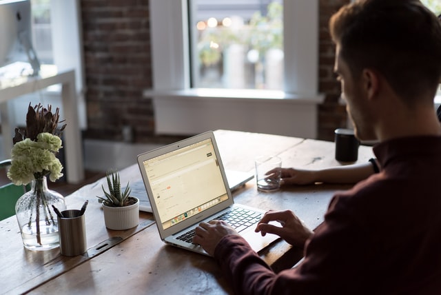 Man typing on laptop