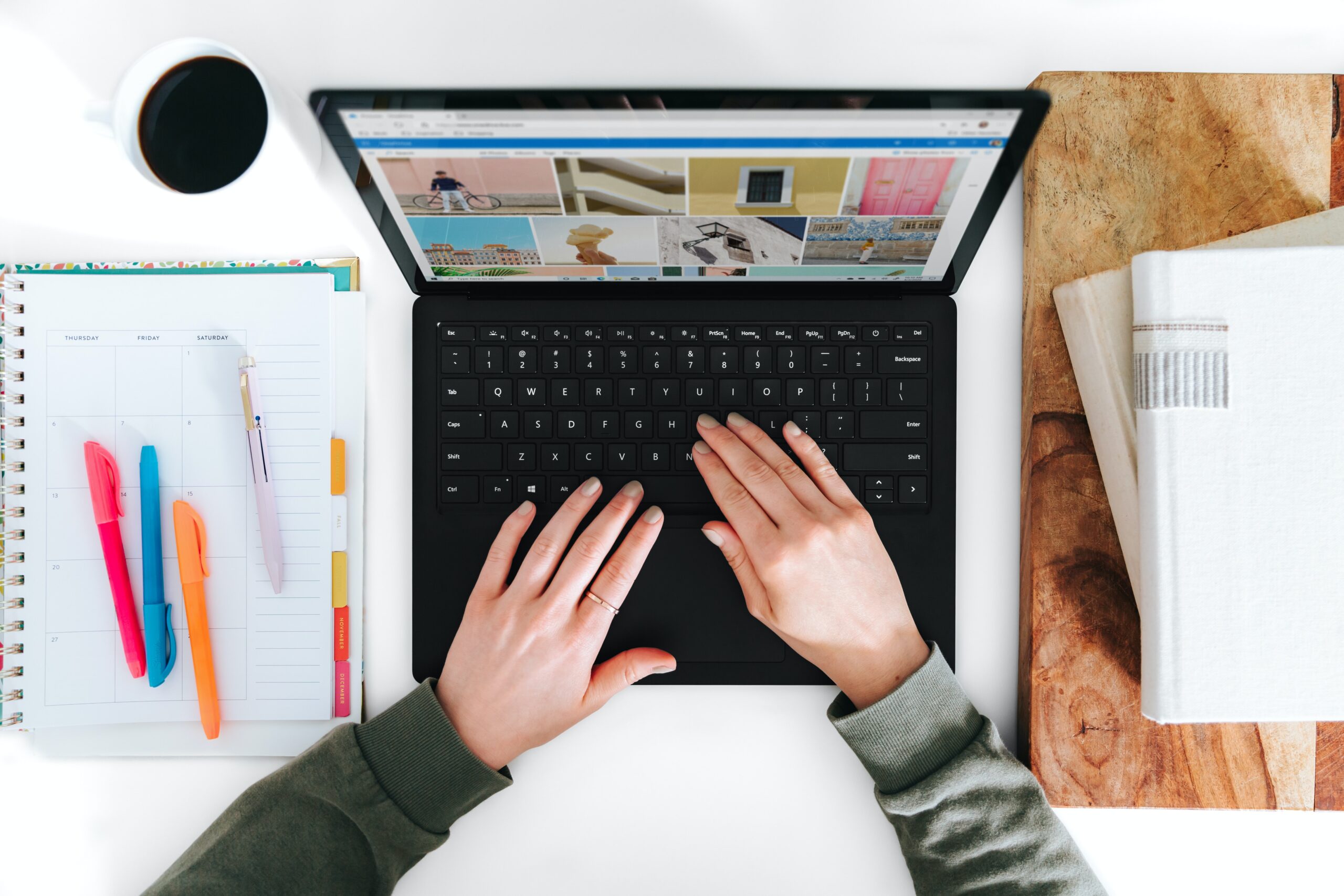 Bird's-eye view of someone working on a laptop.