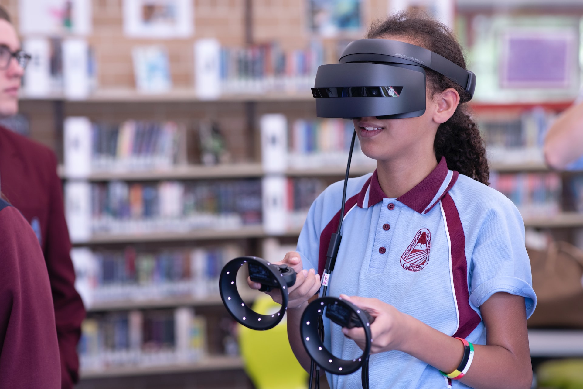 Student in classroom using VR technology